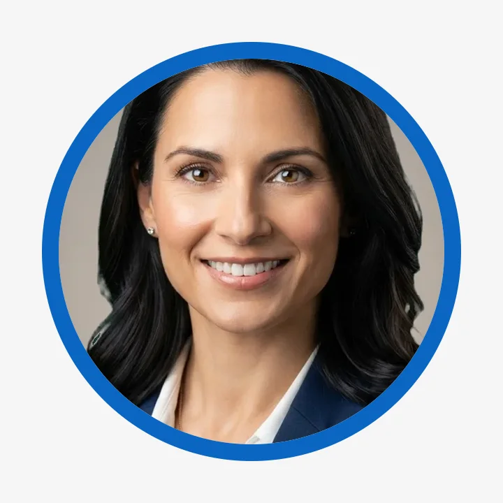 Round profile picture with a blue brand-color ring on a light background