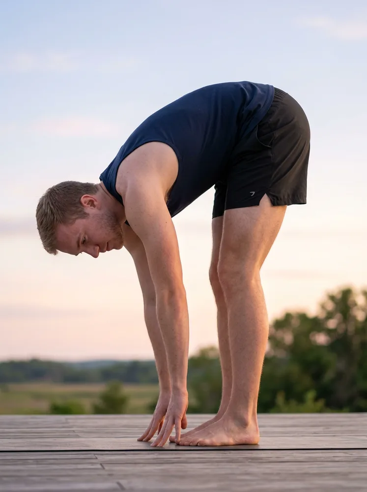Example yoga photo, forward fold on a deck outdoors